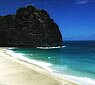 Shadows cover half of Kalalau beach on Kauai's famous Na Pali Coast