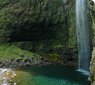 Waterfall spilling into a pool at the end of Hanakapi'ai trail